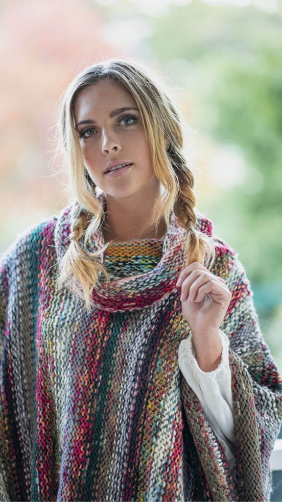 Lady wearing a poncho for the colder months